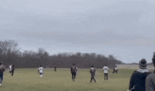 a group of people are playing soccer on a field