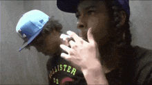 a boy wearing a hollister shirt smoking a cigarette