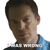 a man in a blue shirt has the words i was wrong written on his face