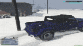 a blue truck is driving in the snow and the screen says sandy grove