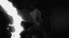 a black and white drawing of a person 's face with a star on it .