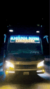 the front of a khánh nam limousine bus at night