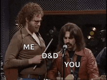 two men are standing next to each other in front of a microphone and talking .