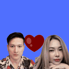 a man and a woman are standing next to each other with a red heart in the background