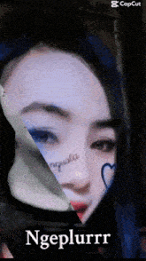 a picture of a woman 's face with a caption that says ngeplurrr