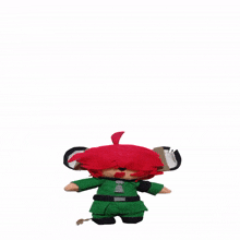 a stuffed toy with red hair and a green outfit