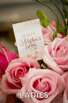 a bouquet of pink roses with a card that says happy mother 's day on it