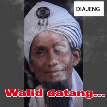 a man with a beard wearing a white turban with the words walid datang on the bottom