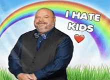 a man is standing in front of a rainbow with the words " i hate kids " written on it
