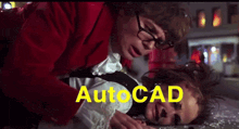 a man in a red jacket is helping a woman who is laying on the ground with autocad written in yellow