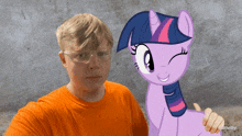 a man wearing safety goggles stands next to a purple pony that says rainway on the bottom