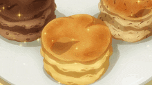 three different types of pastries on a white plate with sparkles