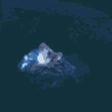 a ghost is flying through the air in a dark room in the dark .