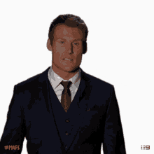 a man in a suit and tie is making a funny face with the hashtag #mafs