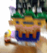 a blurry picture of a lego castle with a blue r on the front