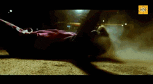 a person is laying on the ground with a hm logo on the bottom