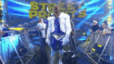 a man in a wrestling costume is standing in front of a sign that says street fighters