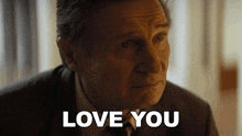 a close up of a man 's face with the words love you behind him