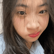 a close up of a woman 's face with red lips