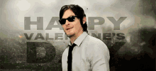 a man wearing sunglasses and a tie says happy valentine 's day .