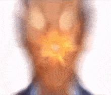 a blurry picture of a person 's face with a flower in the middle of it
