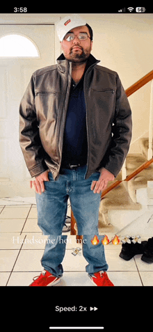 a man wearing a leather jacket and a supreme hat is standing in front of stairs