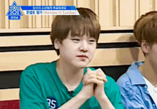 a boy in a green shirt with 95 on it