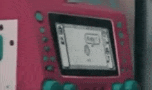 a close up of a pink electronic device with a speech bubble on it .