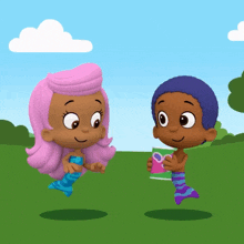 a boy and a girl are standing next to each other in a field