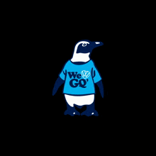 a penguin wears a blue shirt that says we go