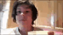 a blurry picture of a man 's face with a blurred background .