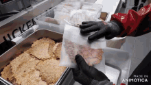 a person is holding a bag of food in front of a machine that says " chicken "