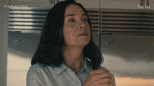 a woman in a kitchen with the words paradise on the bottom