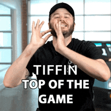 a man clapping his hands with the words tiffin top of the game above him