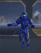 a man in a blue and black armor is standing in front of a window