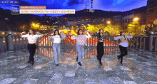 a group of women are dancing on a bridge with the words secret number on the bottom