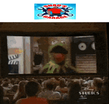 a group of people are watching a sesame street show at a studio