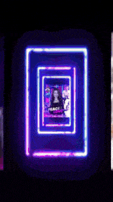 a neon sign with a picture of a girl and the words peace love