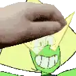 a hand is holding a donut over a cartoon character 's head .