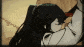 a girl with long black hair is hugging a man with a chain around her neck