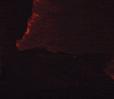 a close up of a person 's face with smoke coming out of their mouth