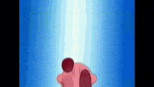 kirby is standing in front of a blue background with a light coming out of it .