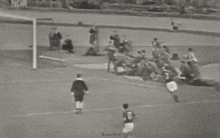 a black and white photo of a soccer game with the words retro foot on the bottom left