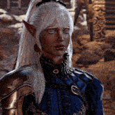 a woman with white hair and elf ears is wearing a blue shirt