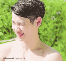 a gif of a shirtless young man with water coming out of his eyes