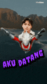 a poster of a boy and a superhero with aku datang written on it