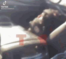 a person is sitting in the driver 's seat of a car with a bloody face .