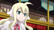 a cartoon character with blonde hair and green eyes is smiling
