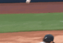 a blurry picture of a baseball player swinging a bat at a ball