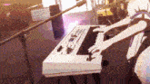 a person is playing a keyboard on a stage .